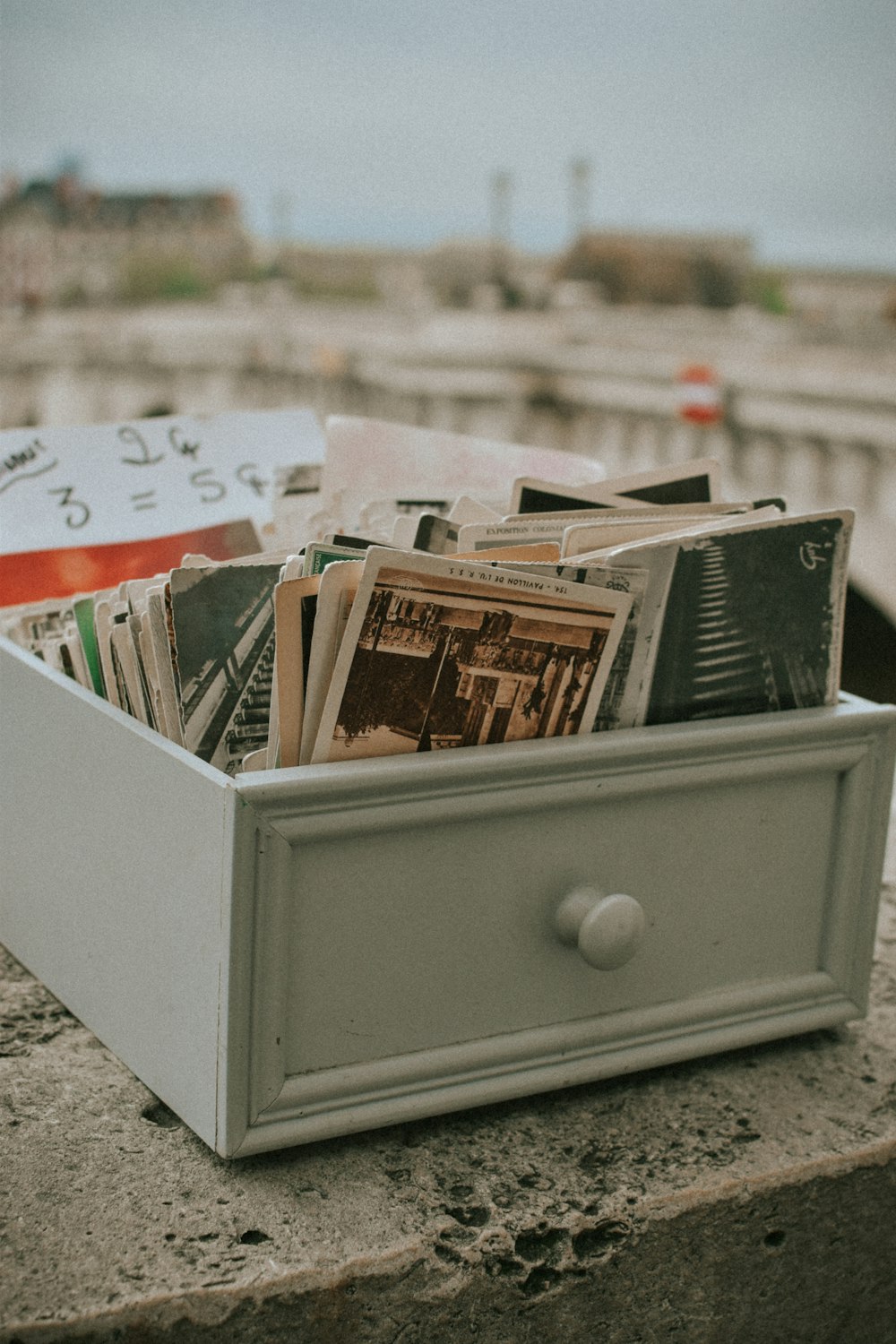 a box of magazines sitting on a ledge