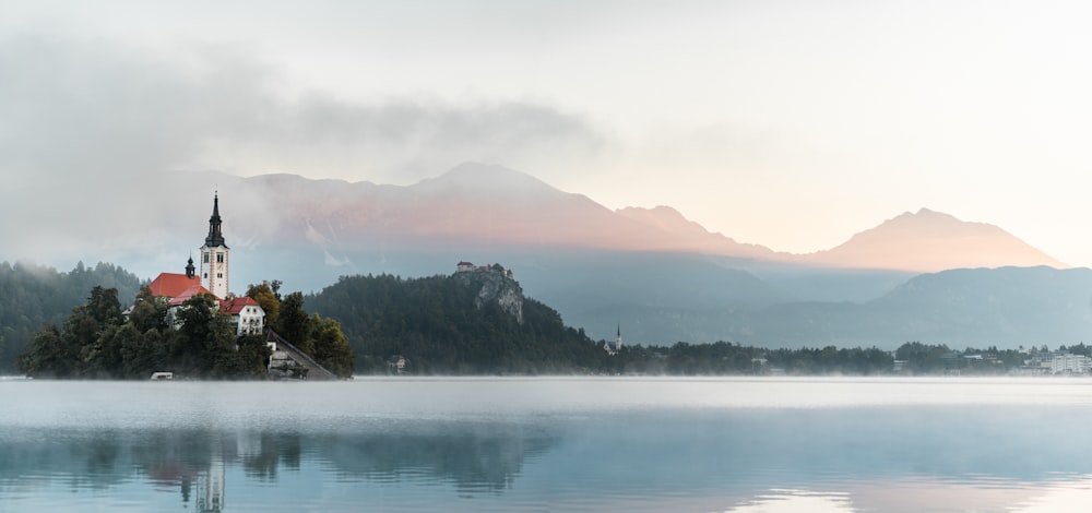 a small island with a church on it in the middle of a lake