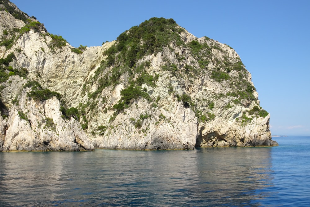 a rock outcropping in the middle of the ocean