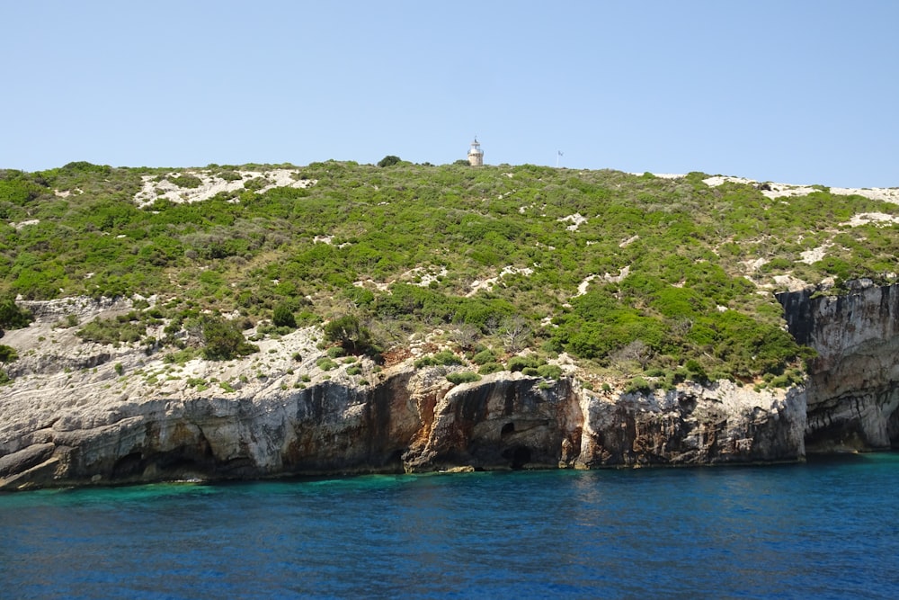 an island with a lighthouse on top of it