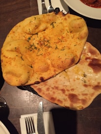 An assortment of naan and kitchen items available at Madina Halal Market.