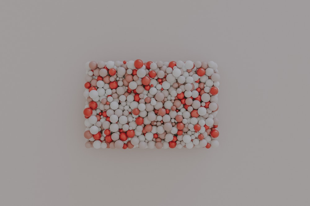 a group of red and white pills arranged in a square