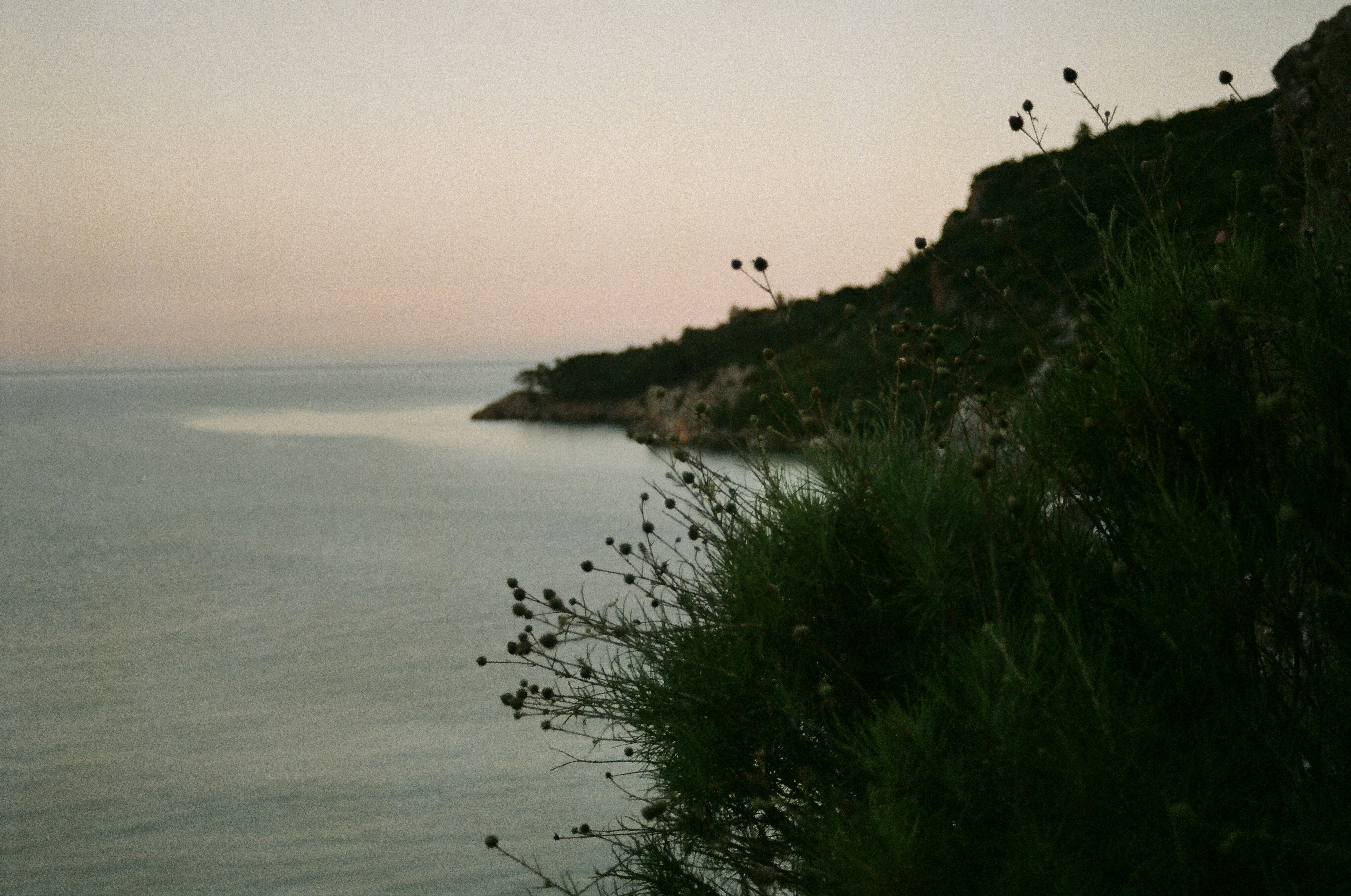 a view of a body of water from a cliff