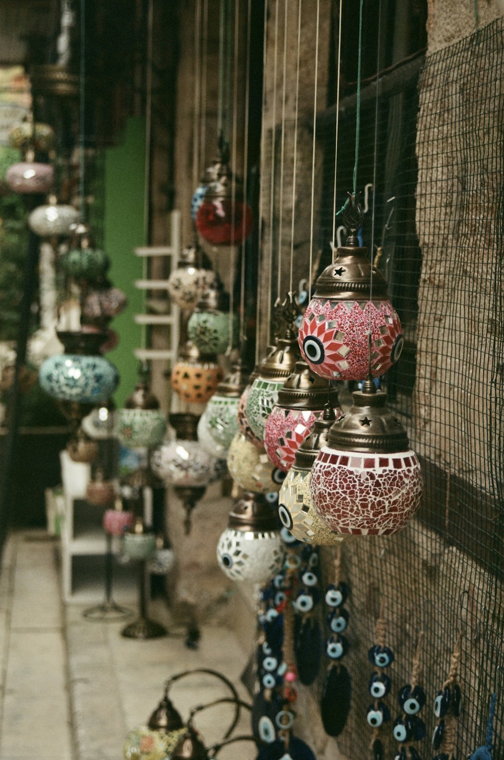 a bunch of colorful lights hanging from a wall