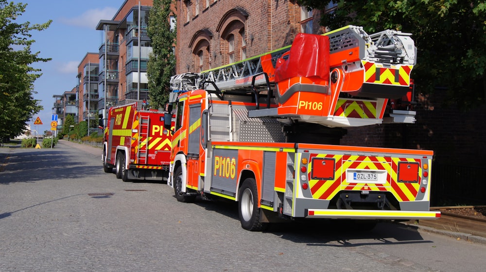 a couple of fire trucks parked next to each other