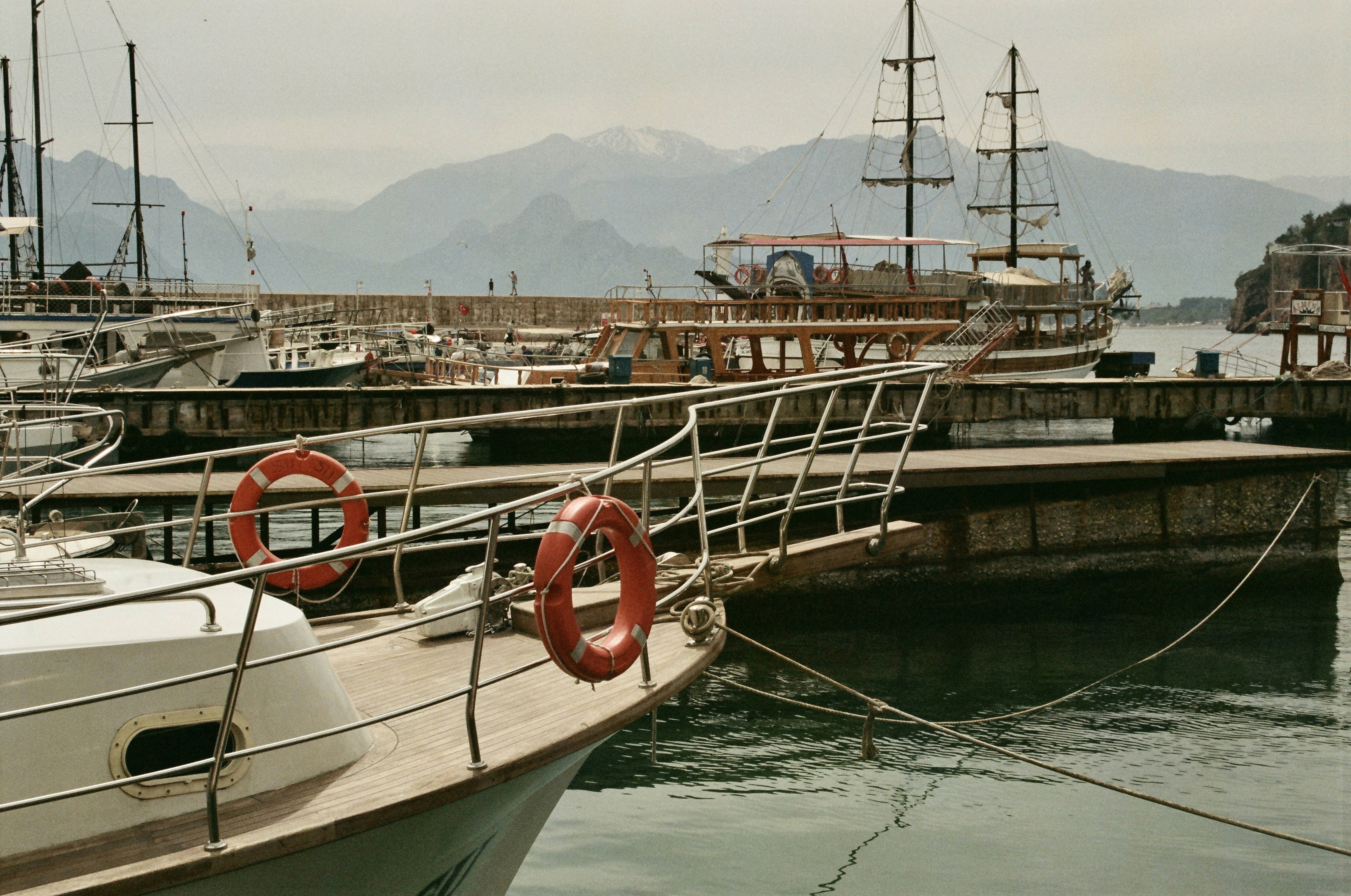 a group of boats docked at a pier