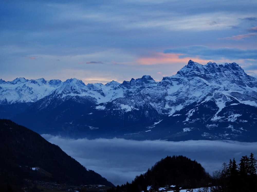 a view of a mountain range covered in snow