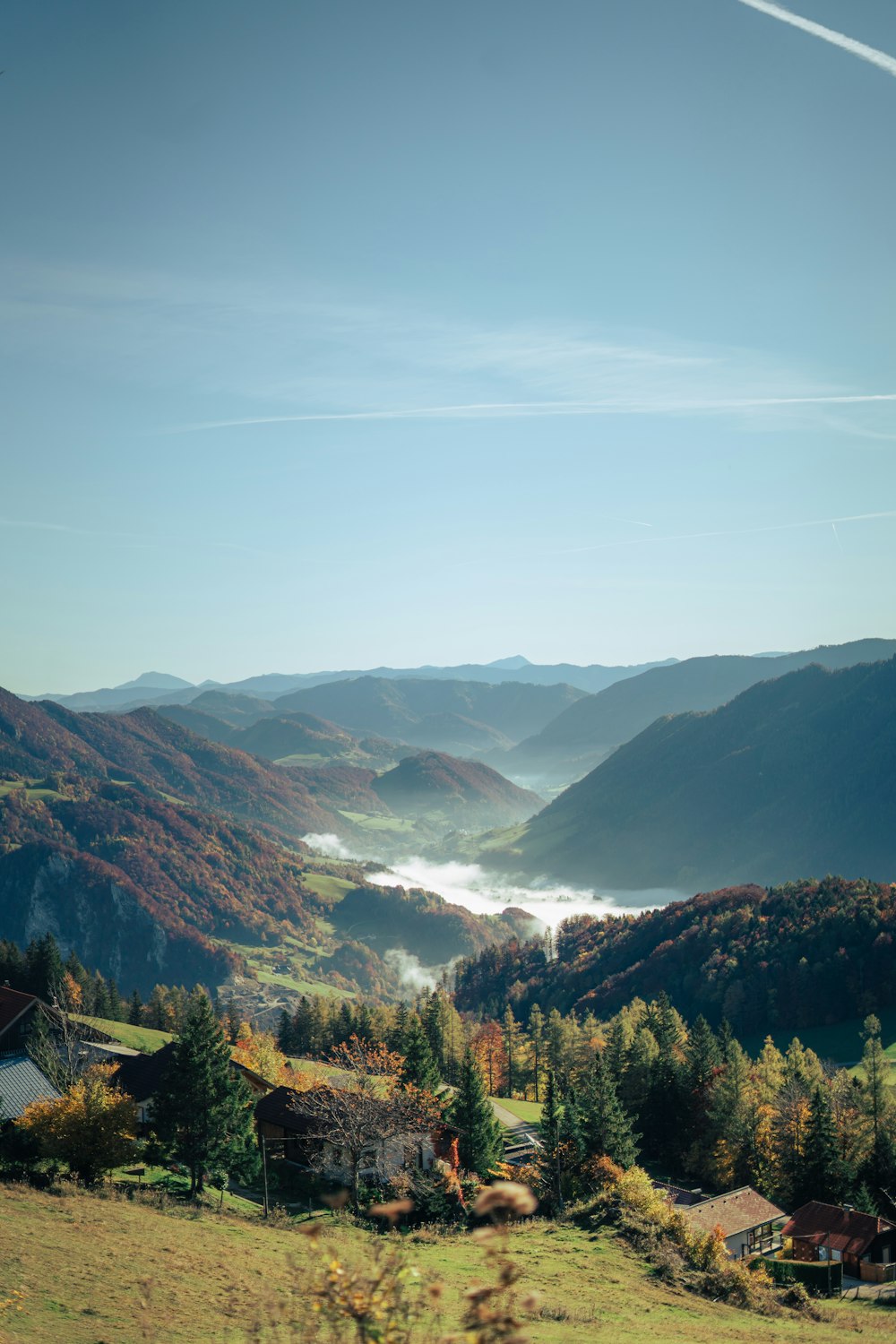 a scenic view of a valley in the mountains