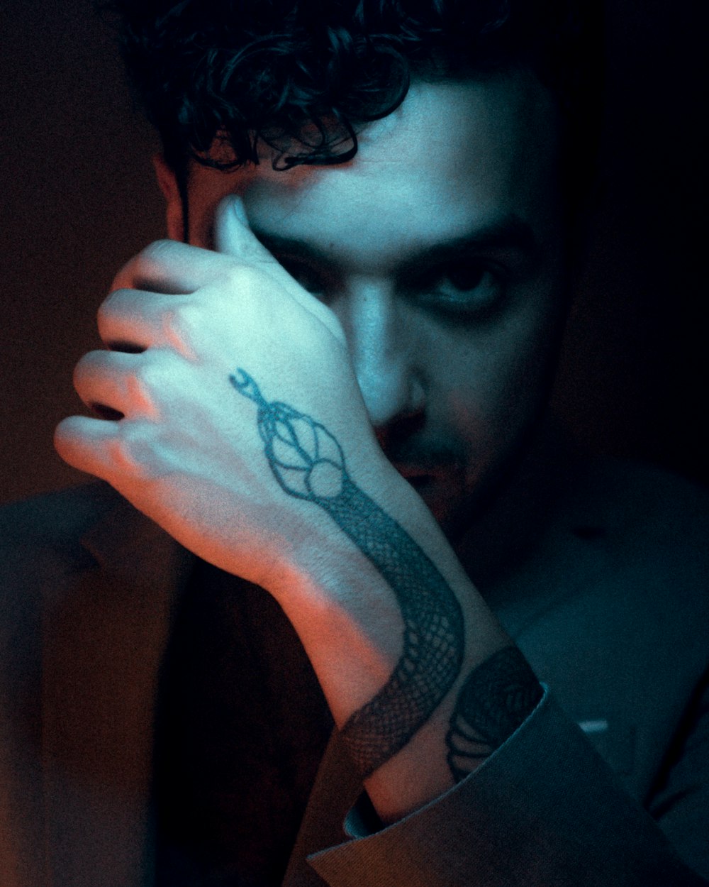 a man with a tattoo on his arm