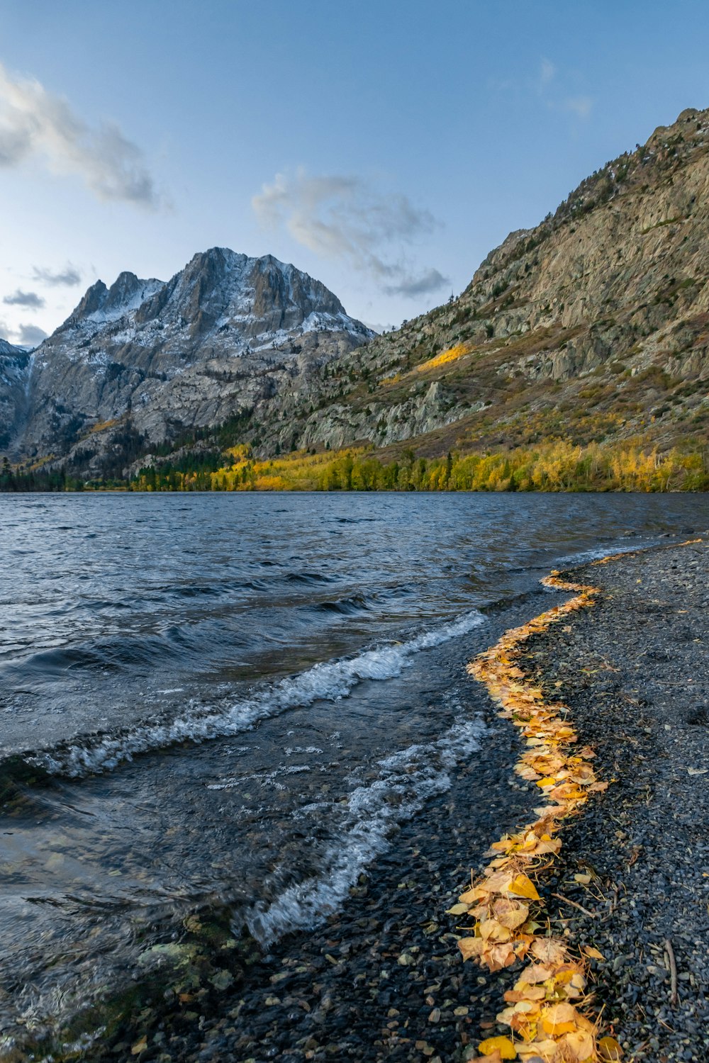 a body of water with a mountain in the background