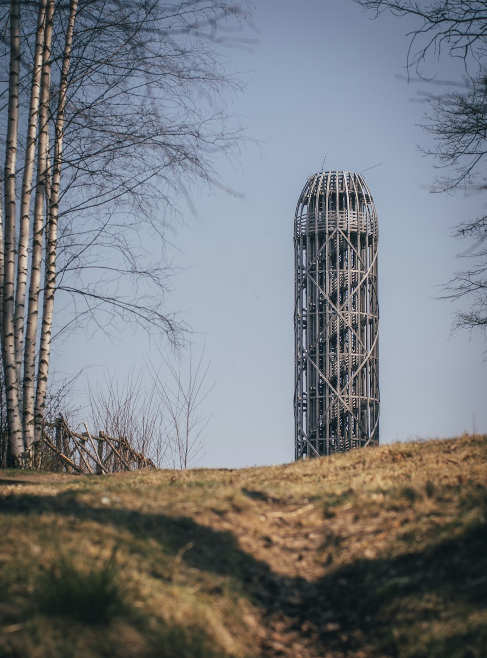 a tall metal structure sitting on top of a hill