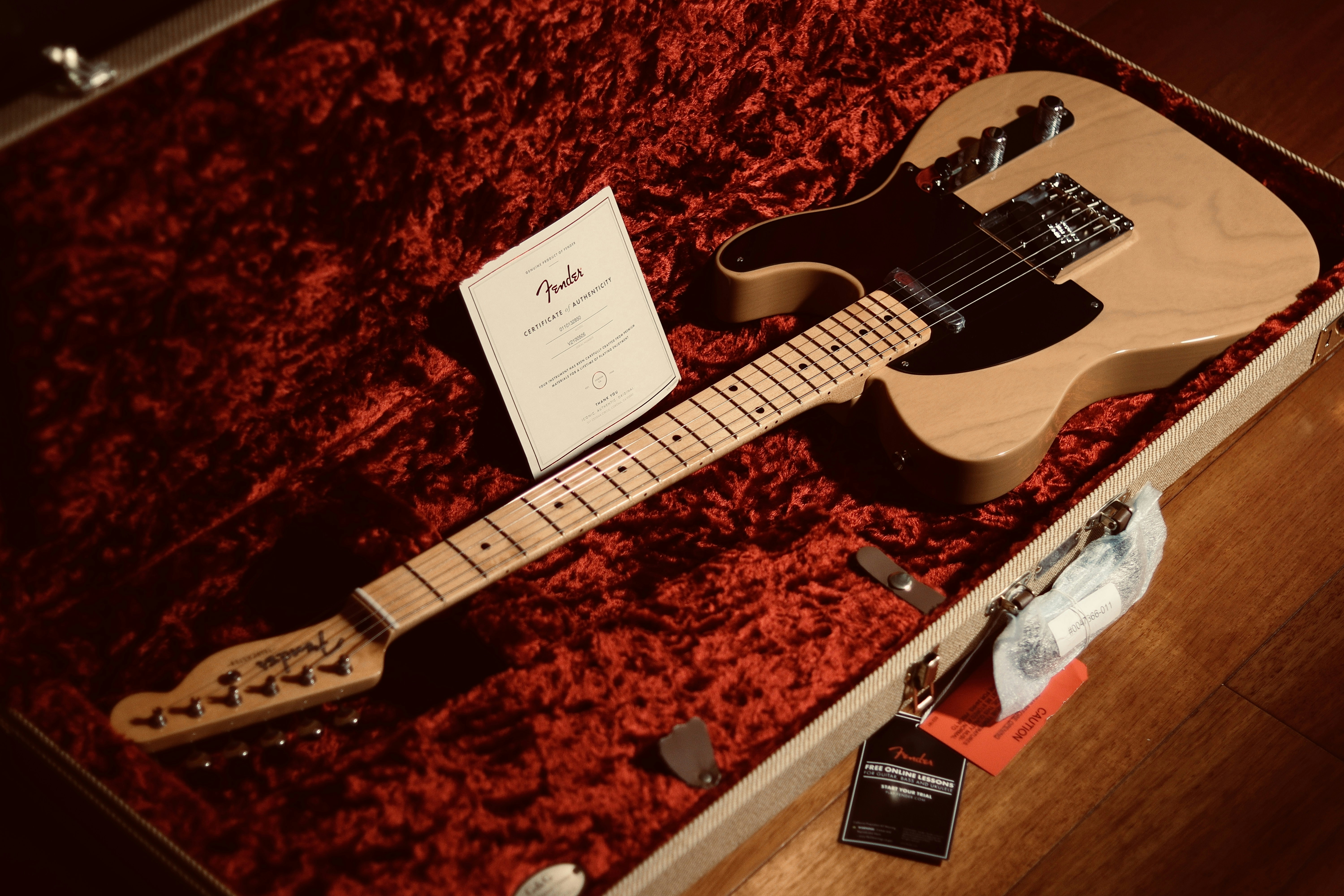 an electric guitar in a case with a note