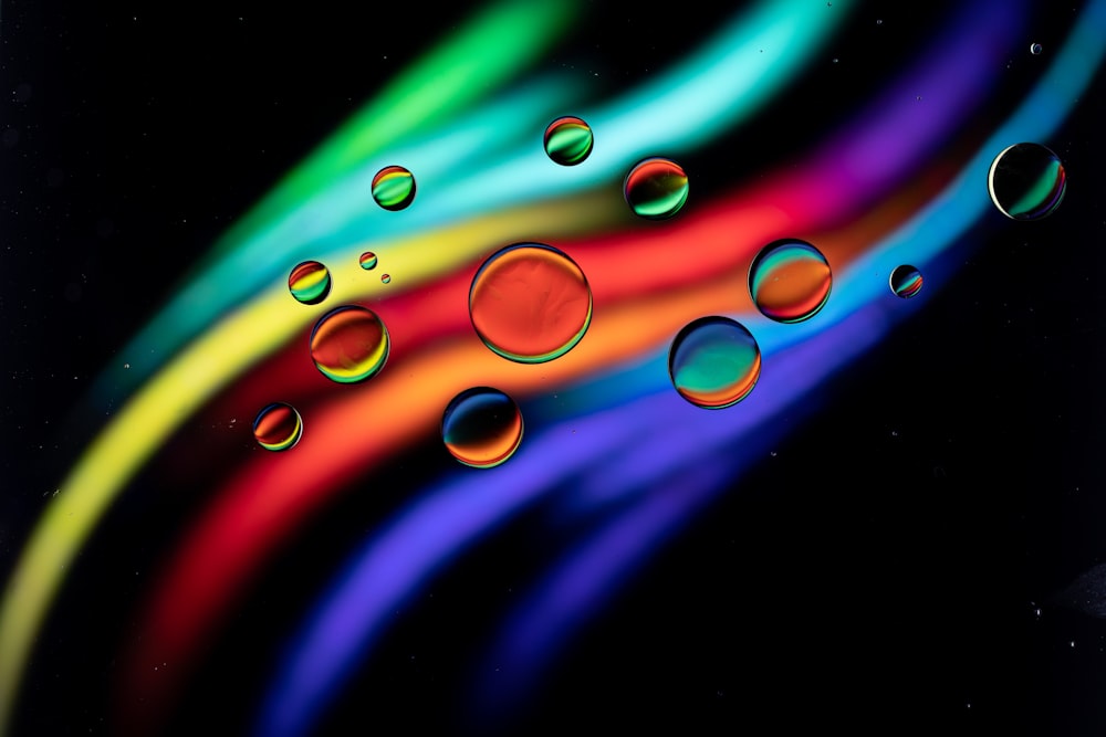 a multicolored background with bubbles of water