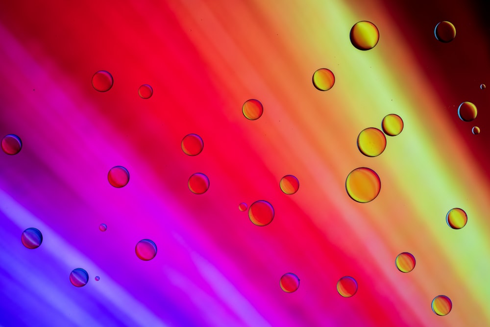 a multicolored background with drops of water