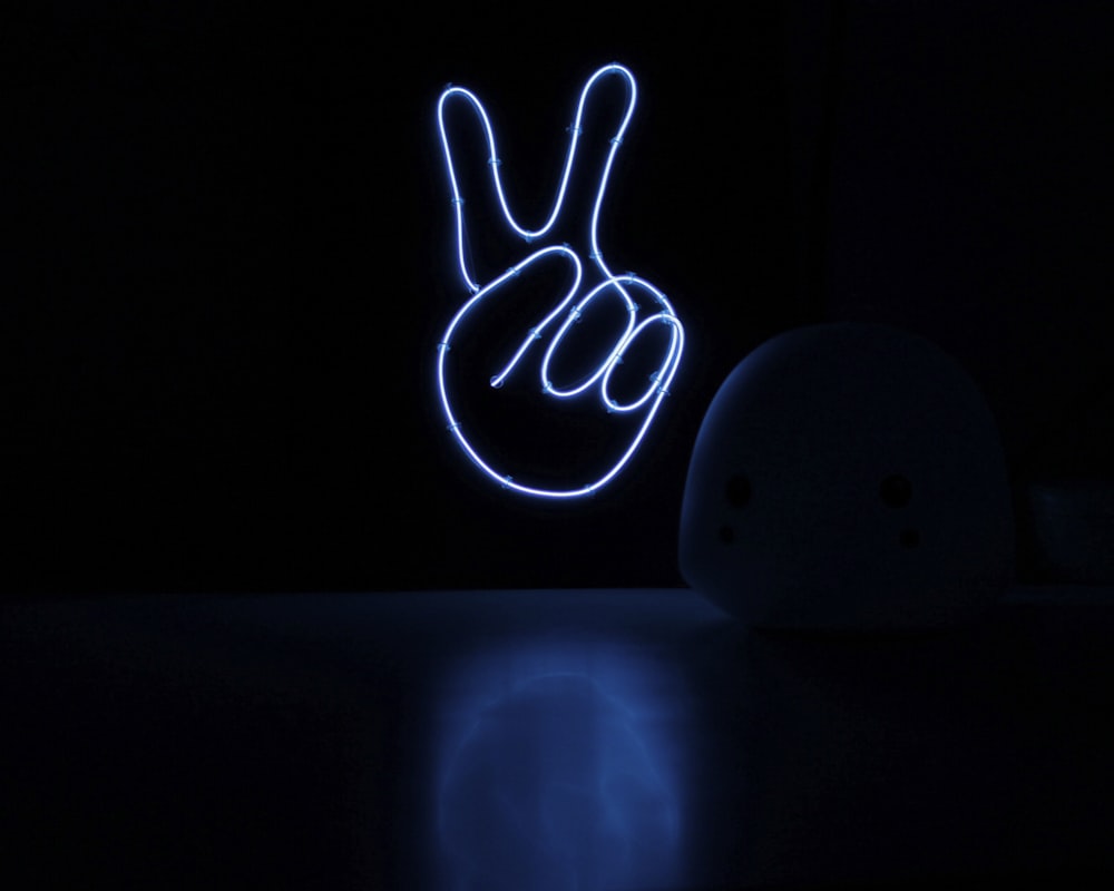 a light up peace sign sitting on top of a table