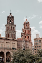 a large building with two towers on top of it