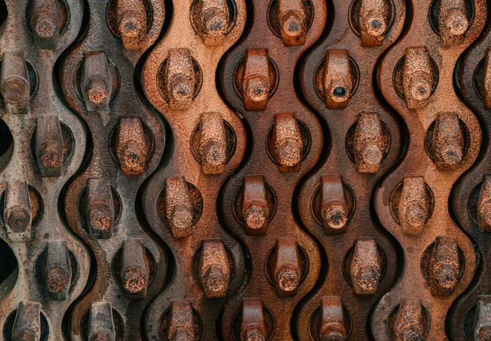 a close up of a metal structure with holes in it