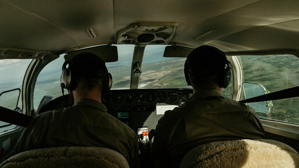 two pilots in the cockpit of an airplane