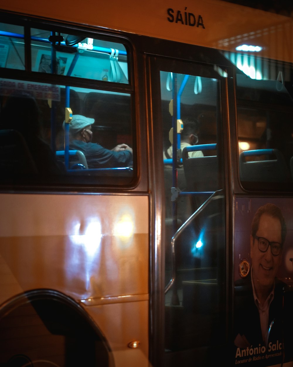 a man sitting in a bus at night