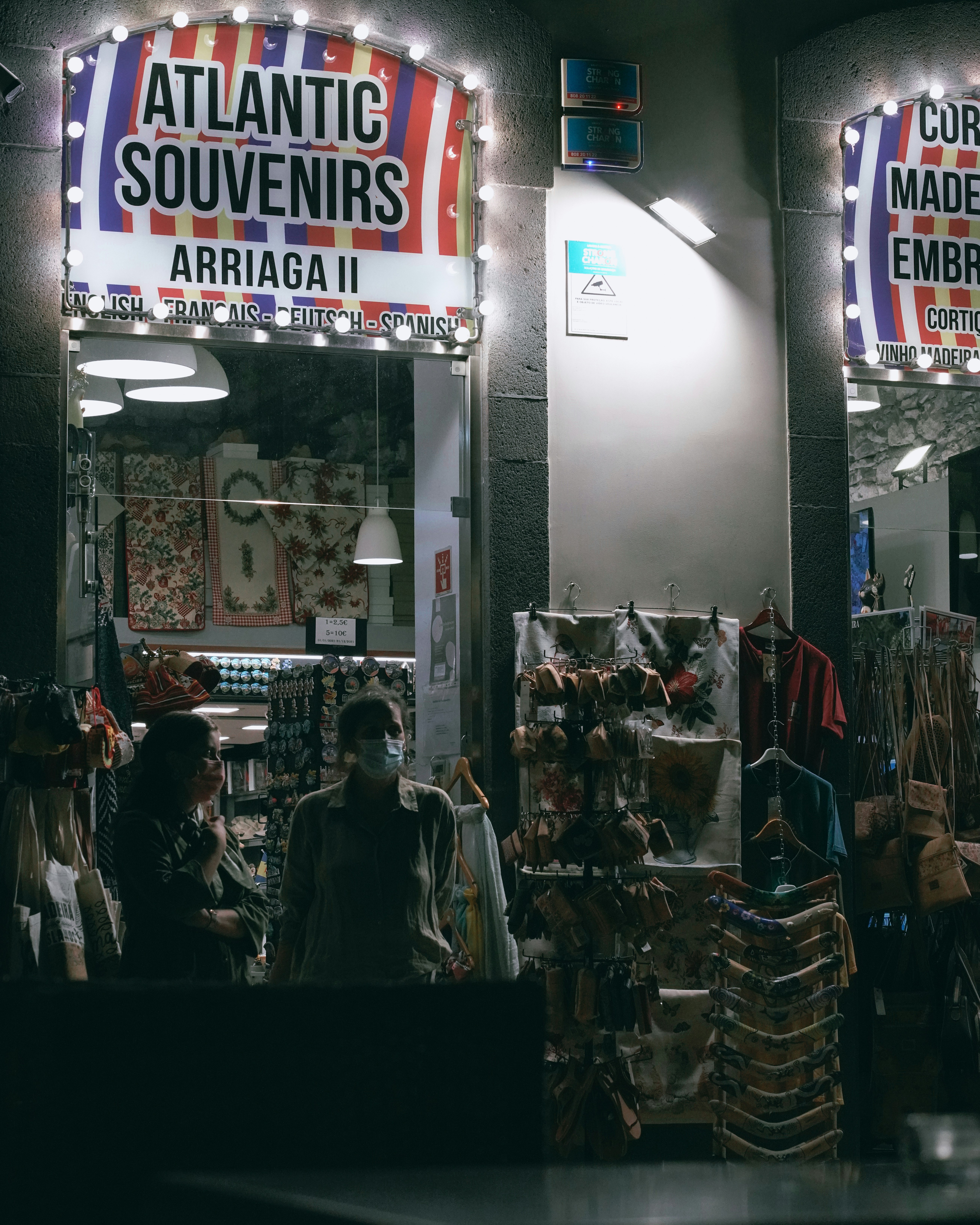 a group of people standing in front of a store