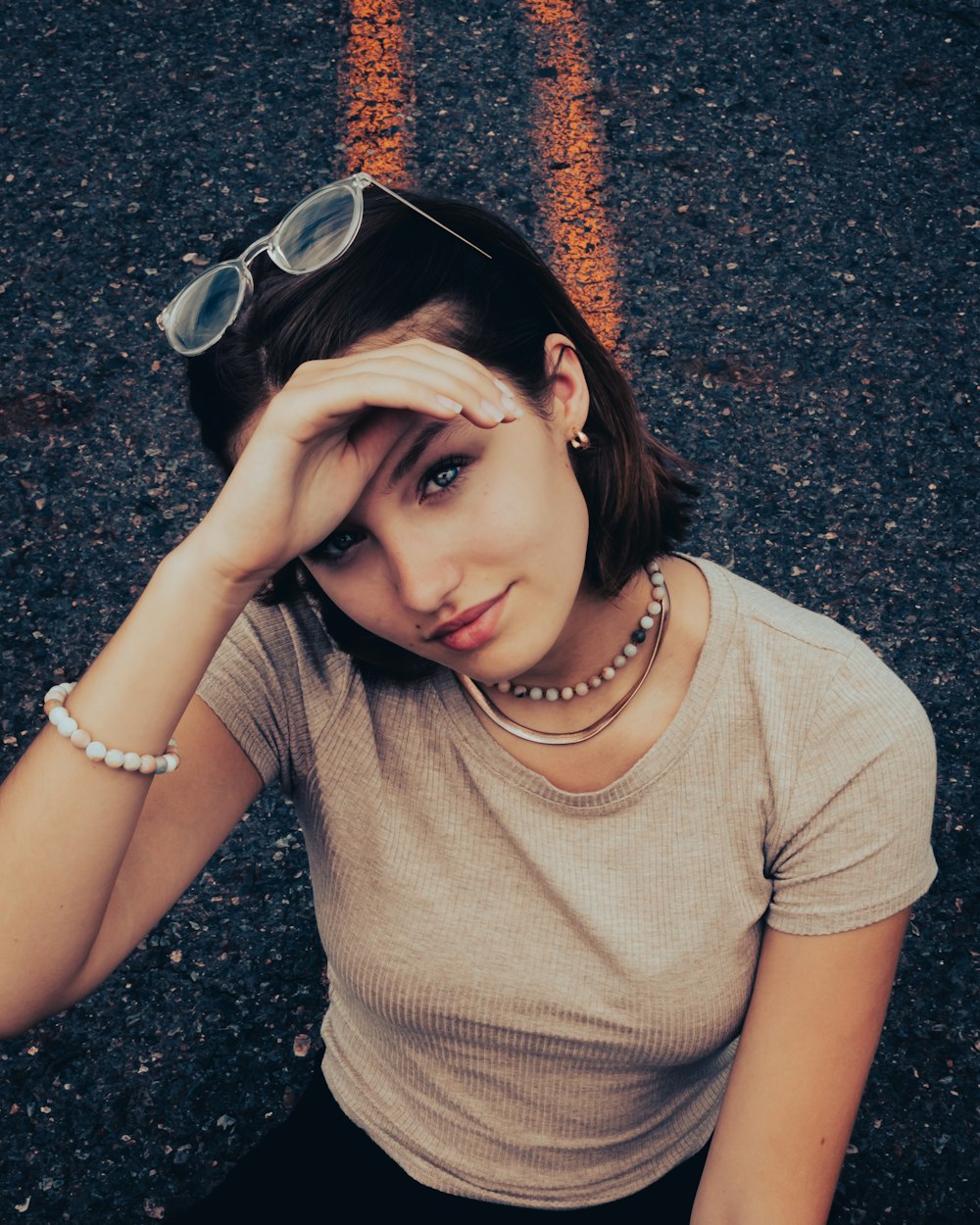 a woman with her hands on her head