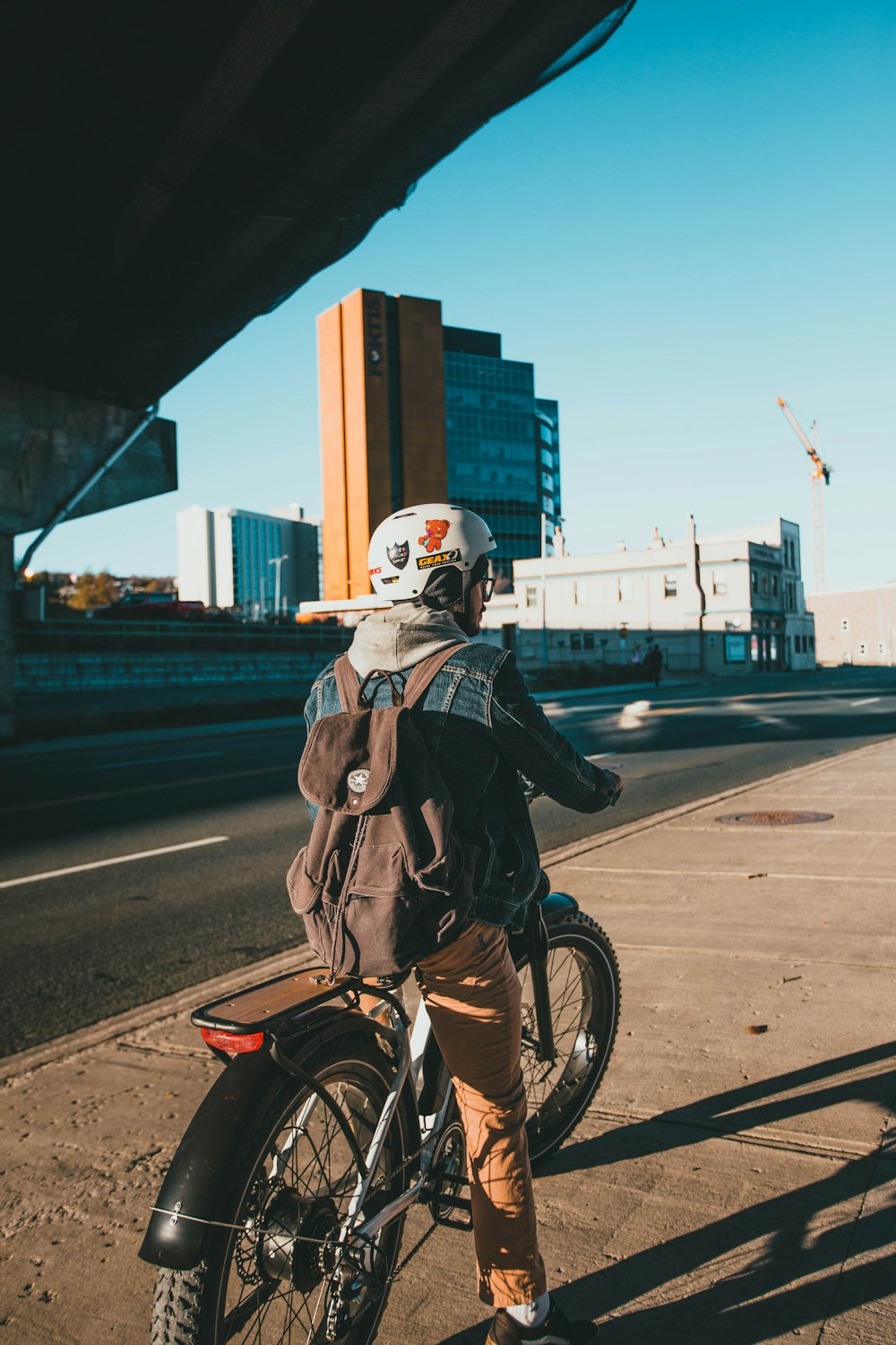 a person riding a motorcycle on a city street