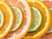 a group of oranges and limes cut in half for detox