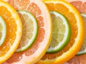 a group of oranges and limes cut in half for detox