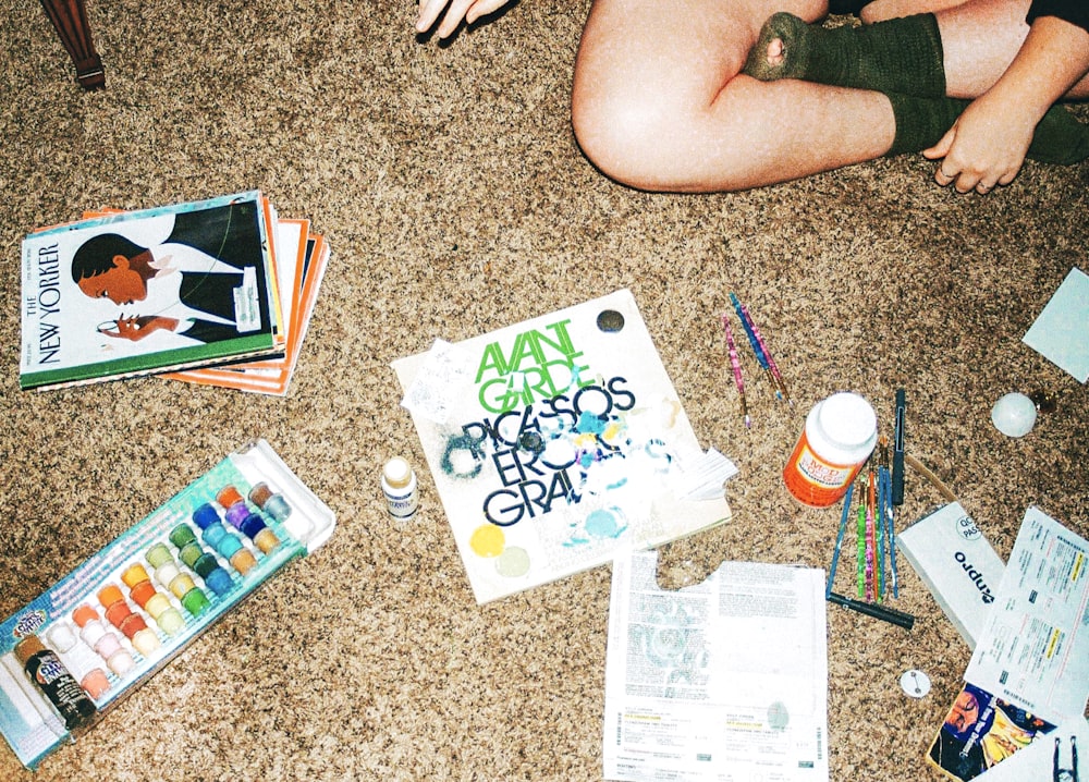 a woman sitting on the floor with her feet on the floor