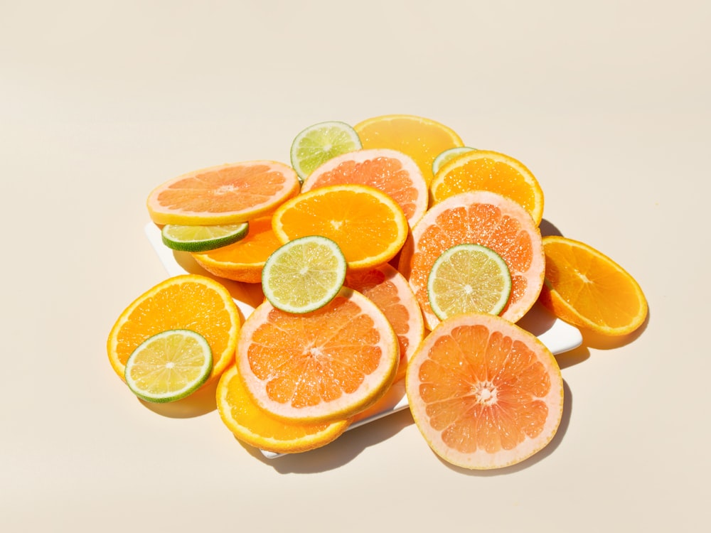 a pile of sliced oranges sitting on top of a table
