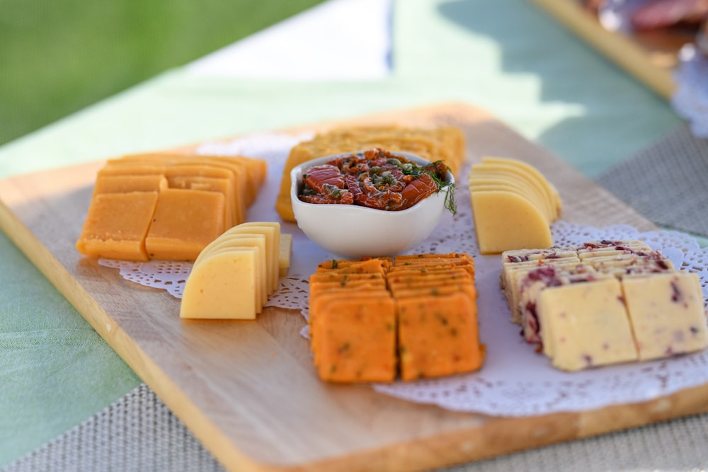 a plate of cheese and crackers on a table