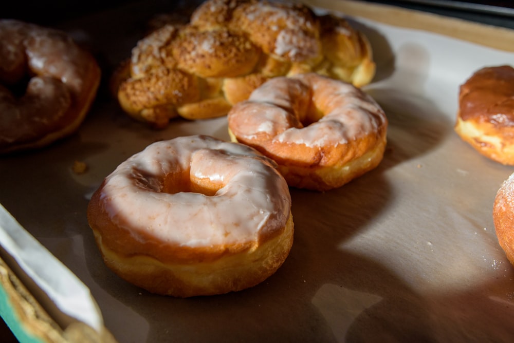 a bunch of doughnuts that are on a tray