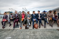 a group of men sitting next to each other