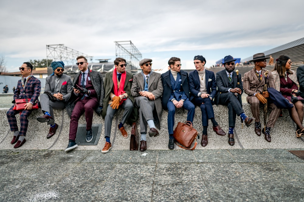 a group of men sitting next to each other