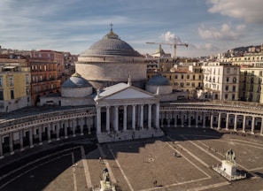 an aerial view of a large building with a dome