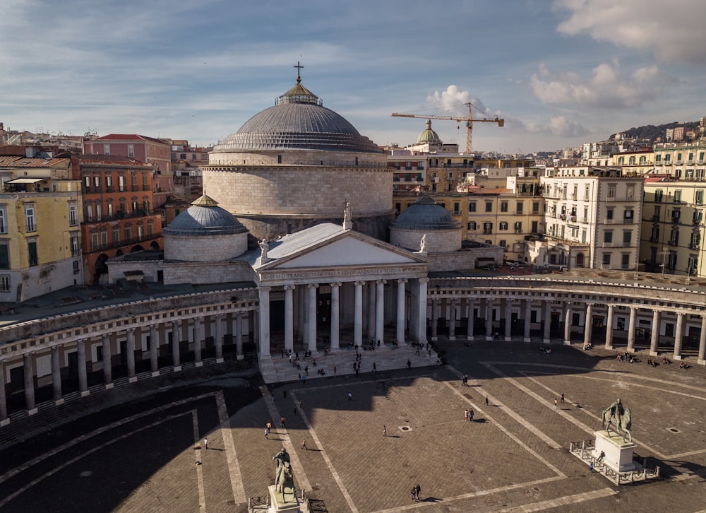 an aerial view of a large building with a dome