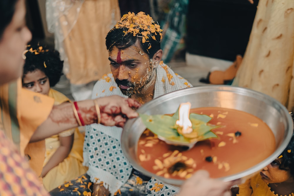 a man is getting food from a woman