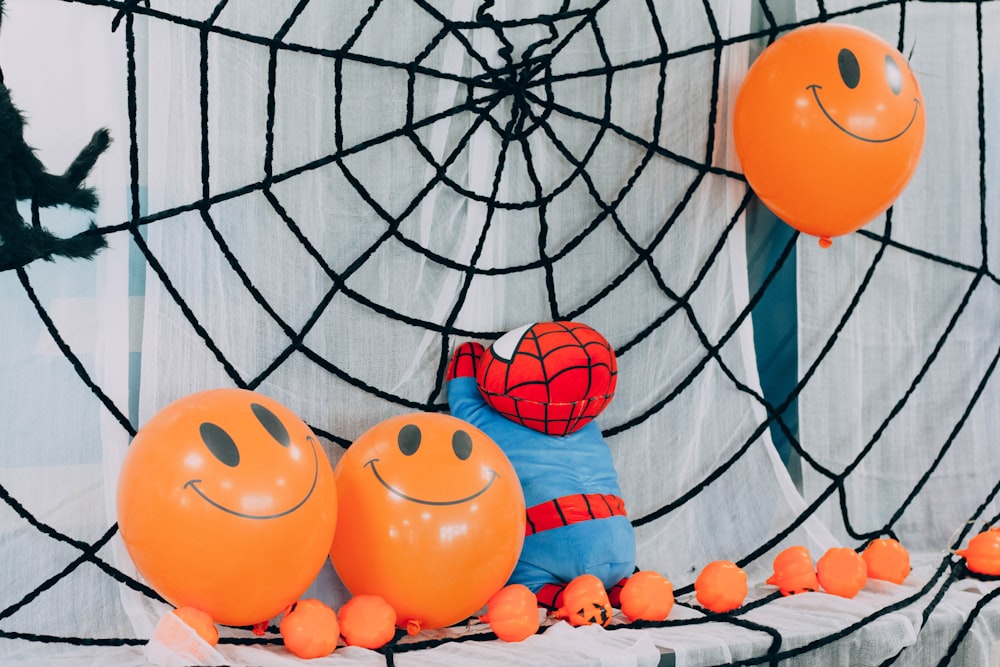 a spiderman balloon sitting on top of a table