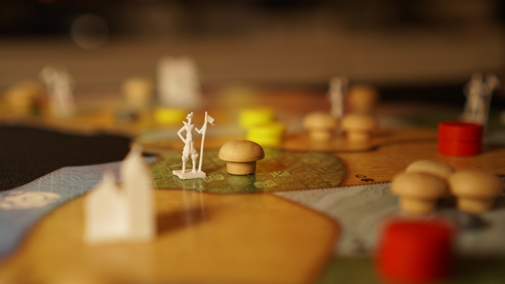 a close up of a board game with figurines on it