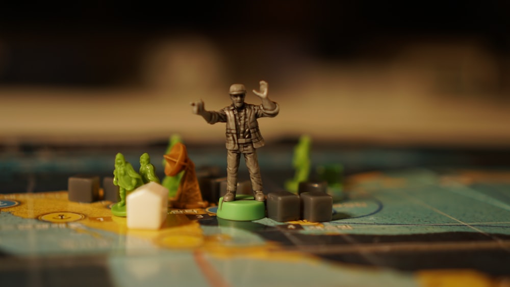 a close up of a game board with a figurine on it