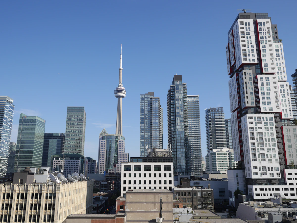 Downtown Toronto skyline of glass office towers seen from street level, the district the PATH runs beneath