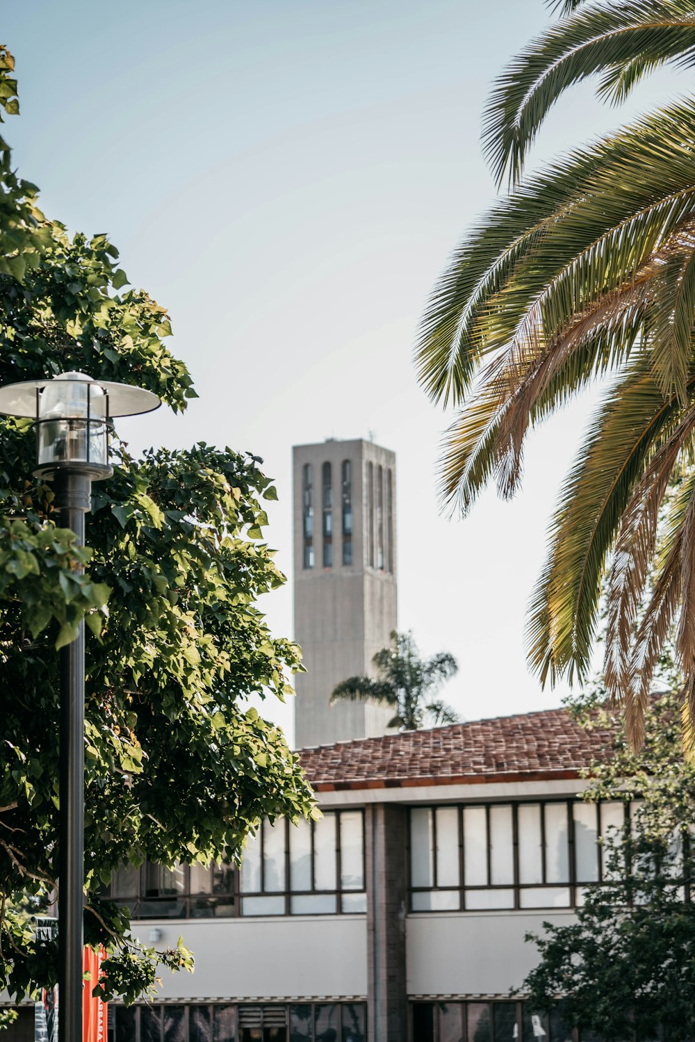 a tall building with a clock tower in the background