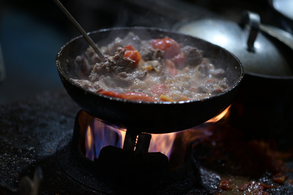 a pot of food cooking on a stove