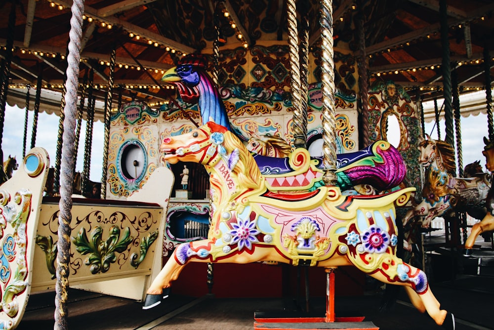 a merry go round with a horse on top of it