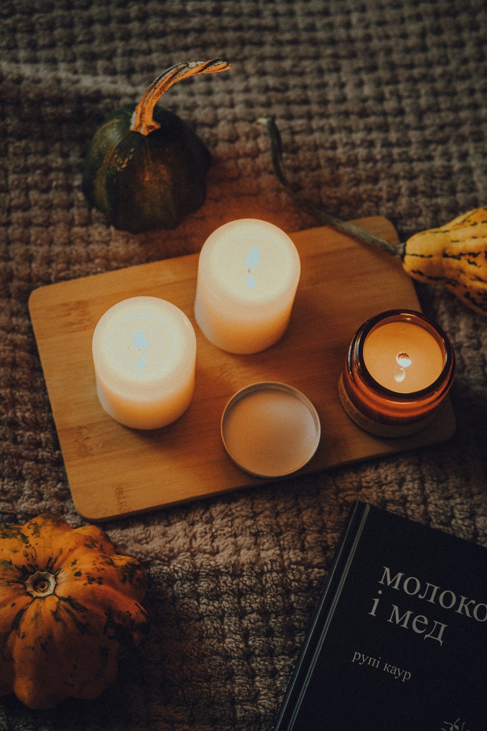 a couple of candles sitting on top of a table