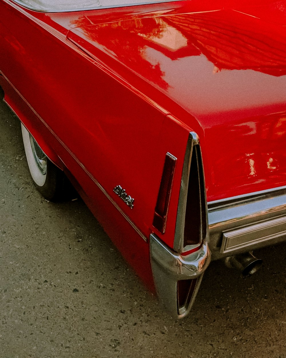 a red car parked on the side of the road