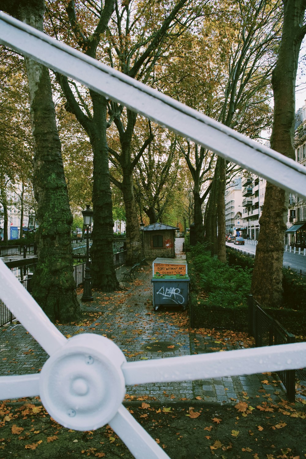 a view of a park through a gate