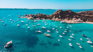 a group of boats floating on top of a body of water