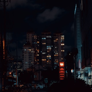 a city at night with a lot of buildings lit up