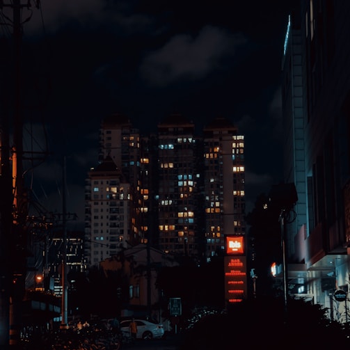 a city at night with a lot of buildings lit up